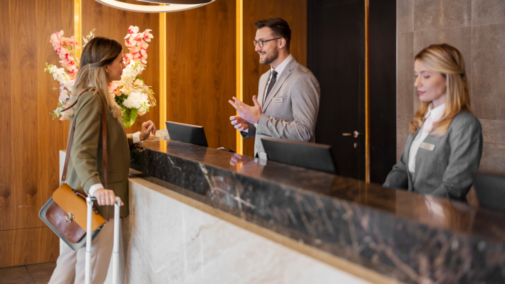 Hotel industry - hotel front desk checking in a guest