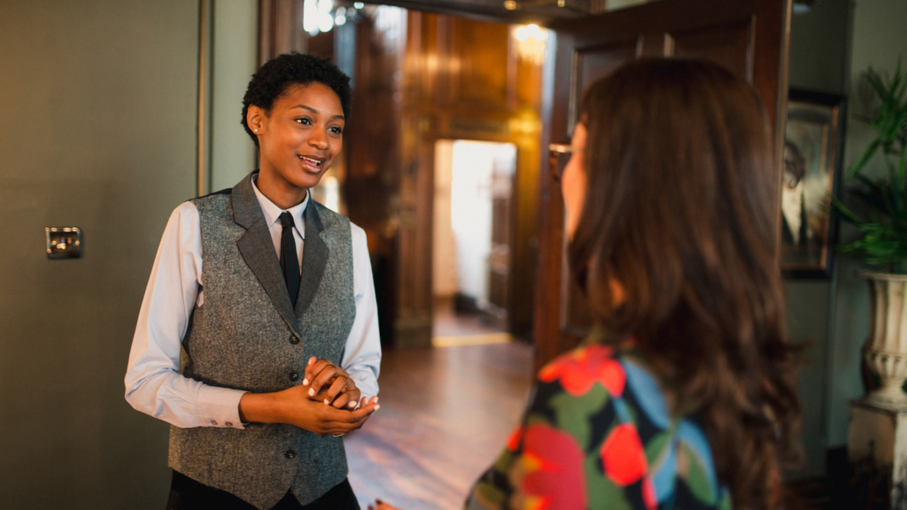Hotel Industry expert employee talking with customer